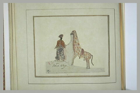 Homme en costume orientale promenant une girafe, image 1/1