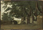 Paysage breton : une grille ombragée par de grands arbres., image 1/3