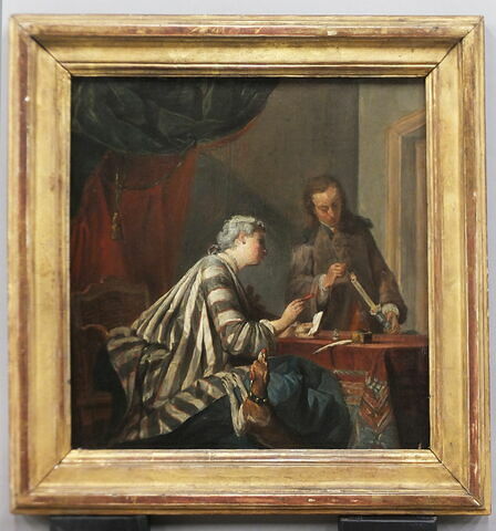 Une femme occupée à cacheter une lettre, image 2/6