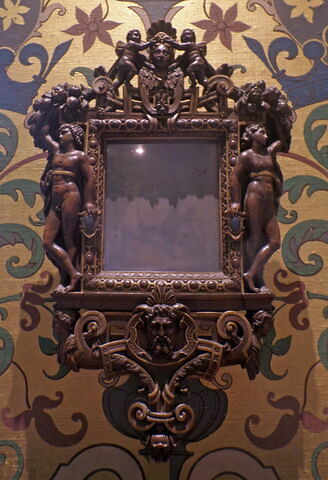 Miroir en glace métallique, dans un cadre en bois sculpté et doré, image 1/5