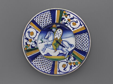 Plat rond : cavalier ; armoiries sur le bouclier
