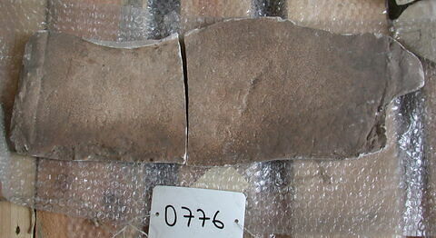 Tirage en deux fragments d'une inscription grecque