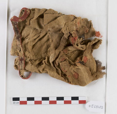 manche d'habit ; bande de poignet ; fragment