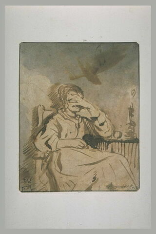Femme assise à une table et abritant ses yeux de la flamme d'une bougie