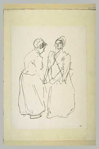 Deux femmes conversant debout, face à face, image 1/1