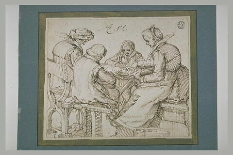Deux femmes et deux jeunes garçons assis autour d'une table, image 1/1