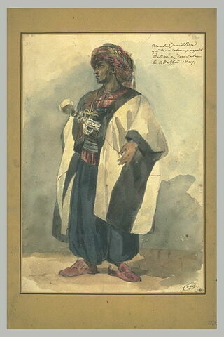 Oriental coiffé d'un turban bariolé et habillé d'un caftan blanc, image 1/1