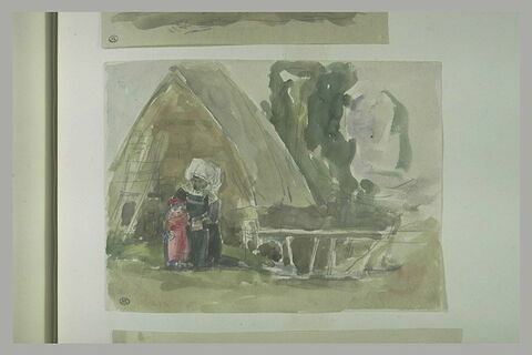 Bretonne, assise, tenant un petit enfant, devant une meule de paille, image 1/1