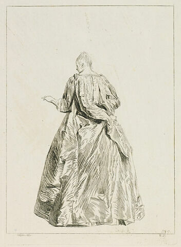 Femme debout, vue de dos, tendant la main gauche, image 1/1