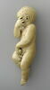 Enfant couché se tenant la tête, image 2/6