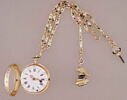 Montre ronde et breloquier, image 1/9